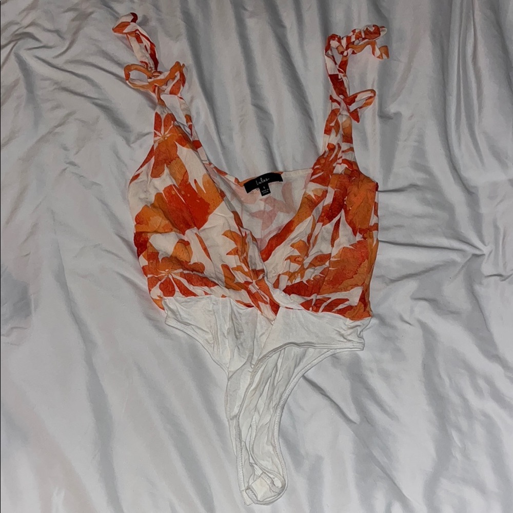 Lulu's White Asymmetrical Sleeveless Bodysuit with Tie Front